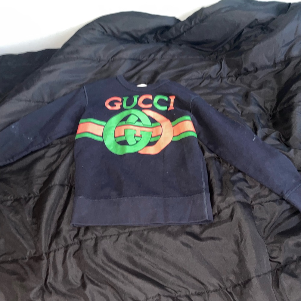 A fending worn twice sweatshirt size 14 also a use kid Versace belt size 14